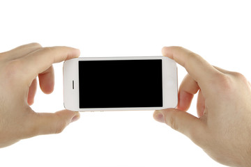 Hands holding mobile smart phone isolated on white