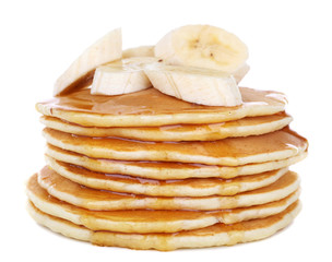Stack of delicious pancakes with slices of banana and honey