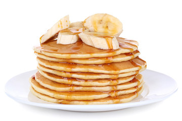 Stack of delicious pancakes with slices of banana and honey