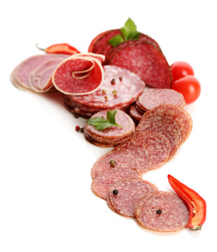 Various sliced salami with chili pepper, cherry tomatoes and