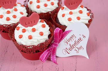 Valentine red velvet cupcakes on wood background