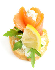 Fototapeta na wymiar Canape with salmon and herbs isolated on white