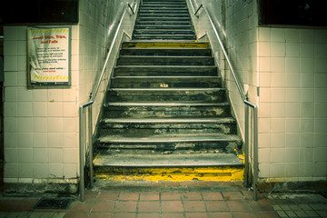 Grungy urban staircase in New York City subway