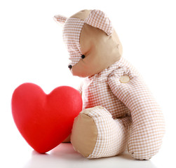 Teddy Bear with red heart isolated on white