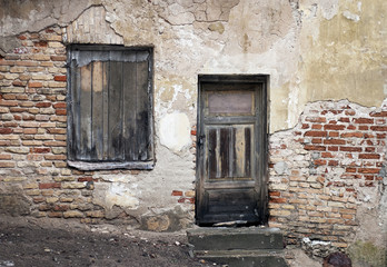 Old window and door with cracked wall