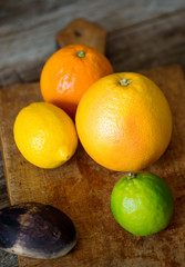 citrus fruits on wooden background
