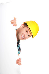 Happy worker presenting empty banner.