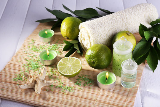 Spa composition with lime, towel and candles