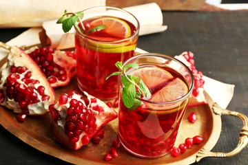 Pomegranate drink in glasses with mint