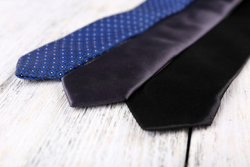 Ties on color wooden planks background
