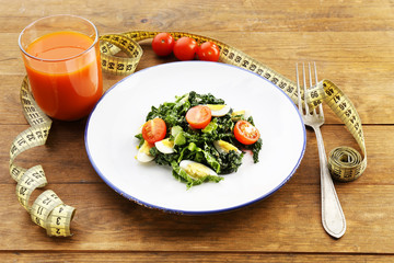 Salad with quail egg and basil in plate