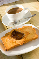 breakfast with rusks and cocoa cream in morning light