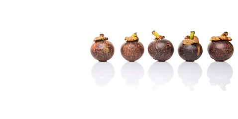 Ripe mangosteen fruit over white background