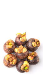 Ripe mangosteen fruit over white background