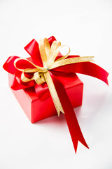 Gold gift box with  ribbon and bow
