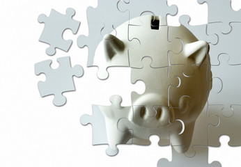 Fototapeta premium piggy bank made of puzzle - economy and finance
