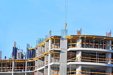 Building construction site work against blue sky