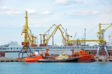 Bunker ship and tugboat under port crane, Odessa, Ukraine
