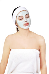 Relaxed woman with a nourishing face mask