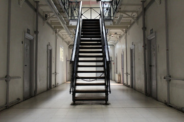 the hallway in a prison cell block