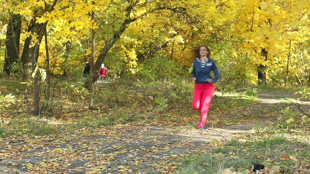 Runner woman running in park