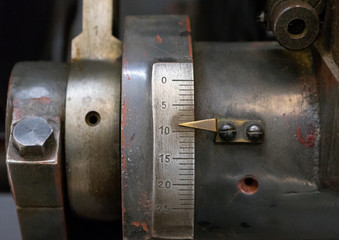 Scale with a pointer on old machine in printing house