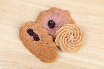 Cookies on wooden table background close up