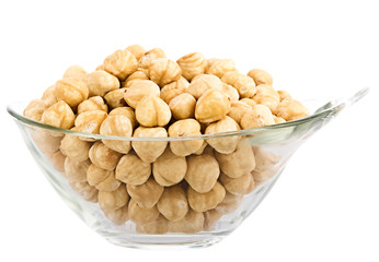hazelnuts in glass piala. Isolation on white background