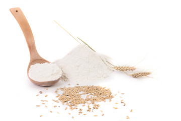 Flour wheat ear and wood spoon.