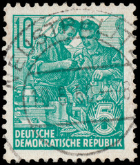 Stamp printed in GDR, shows workers