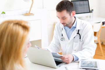Young attractive doctor listening his patient