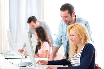 Fototapeta premium Young attractive people taking a training course