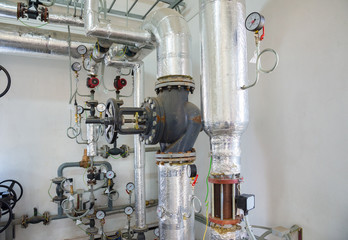 Place in a large industrial boiler room.