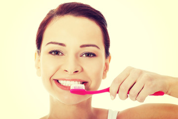 Young woman with toothbrush and paste.