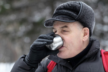 Senior man drinking hot tea