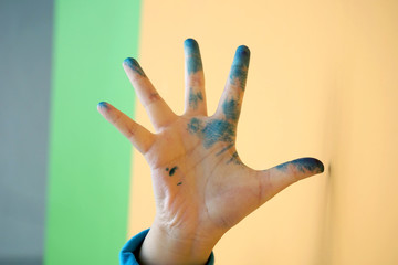 painted dirty kid's hand