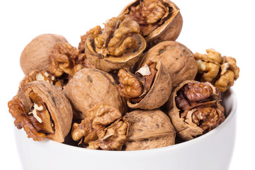 Close up of walnuts bunch in bowl.