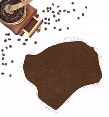 Coffee powder in the shape of Guinea-Bissau and a coffee mill.(s