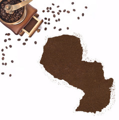 Coffee powder in the shape of Paraguay and a coffee mill.(series