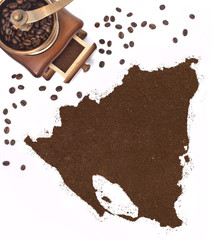 Coffee powder in the shape of Nicaragua and a coffee mill.(serie