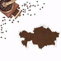 Coffee powder in the shape of Kazakhstan and a coffee mill.(seri