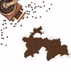Coffee powder in the shape of Tajikistan and a coffee mill.(seri