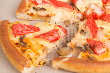 Island Delight pizza on recycle paper background