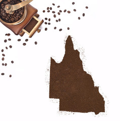 Coffee powder in the shape of Queensland and a coffee mill.(seri