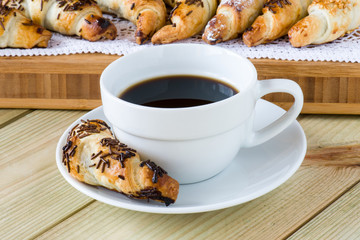 coffee cup with croissants
