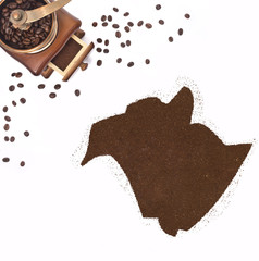 Coffee powder in the shape of New Brunswick and a coffee mill.(s