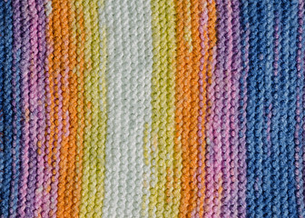 vertical colorful stripes of a knitted blanket