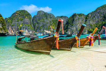 Fototapeta na wymiar Long-tail boats in Maya Bay, Thailand