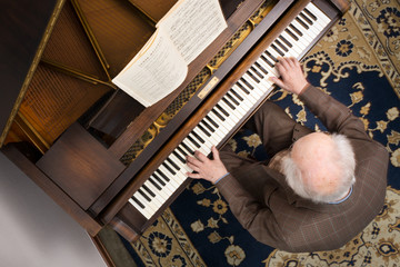 Old man at the grand piano