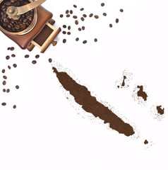 Coffee powder in the shape of New Caledonia and a coffee mill.(s